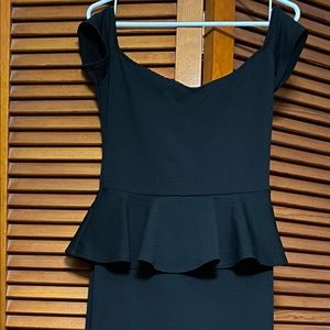 Full length black dress with cap sleeves and high slit in back